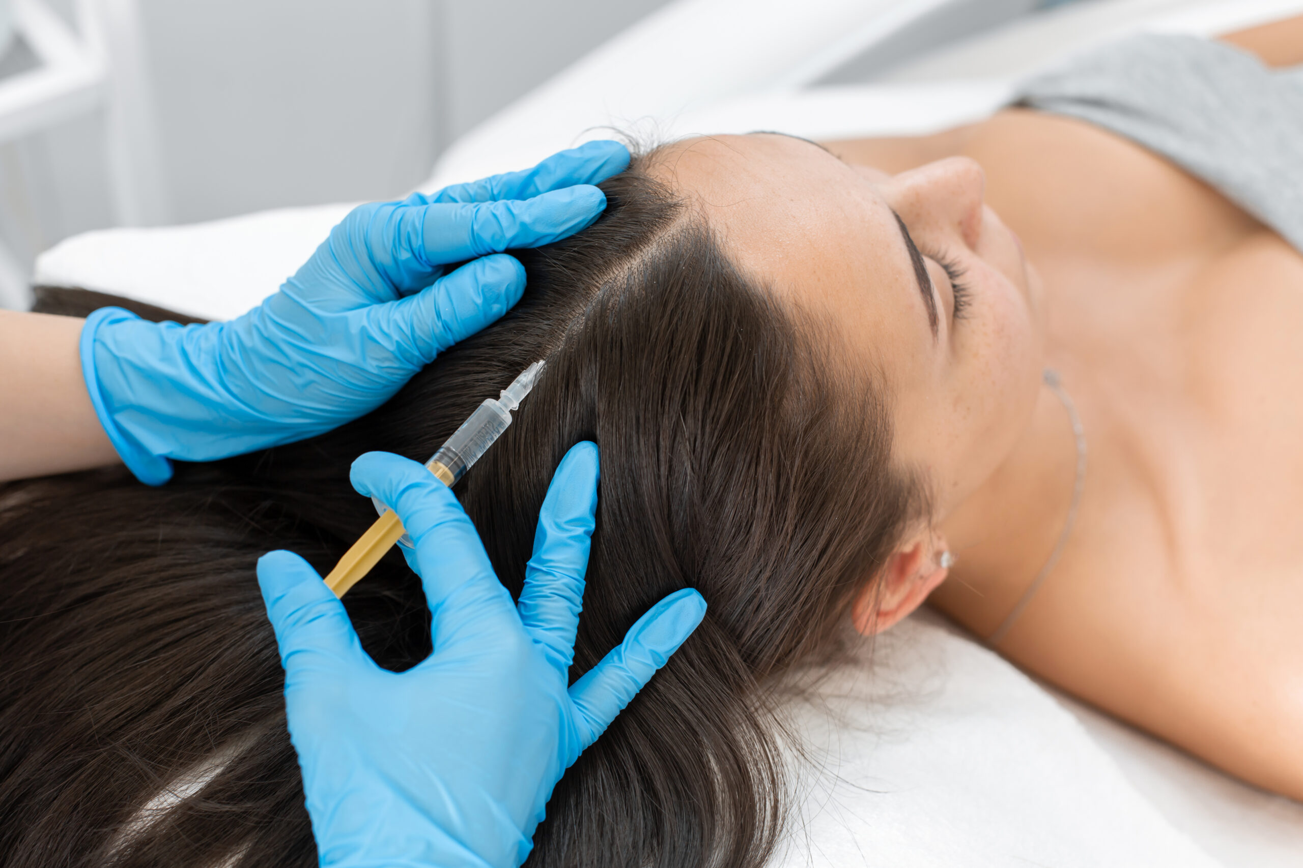 Beautician injections for healthy hair growth. Mesotherapy of the scalp. A young girl is undergoing a course of spa treatments in the office of a beautician. Moisturizing, cleaning and facial skin care. Cosmetic procedures | Perfectly Made Aesthetic Boutique in Prosper, TX